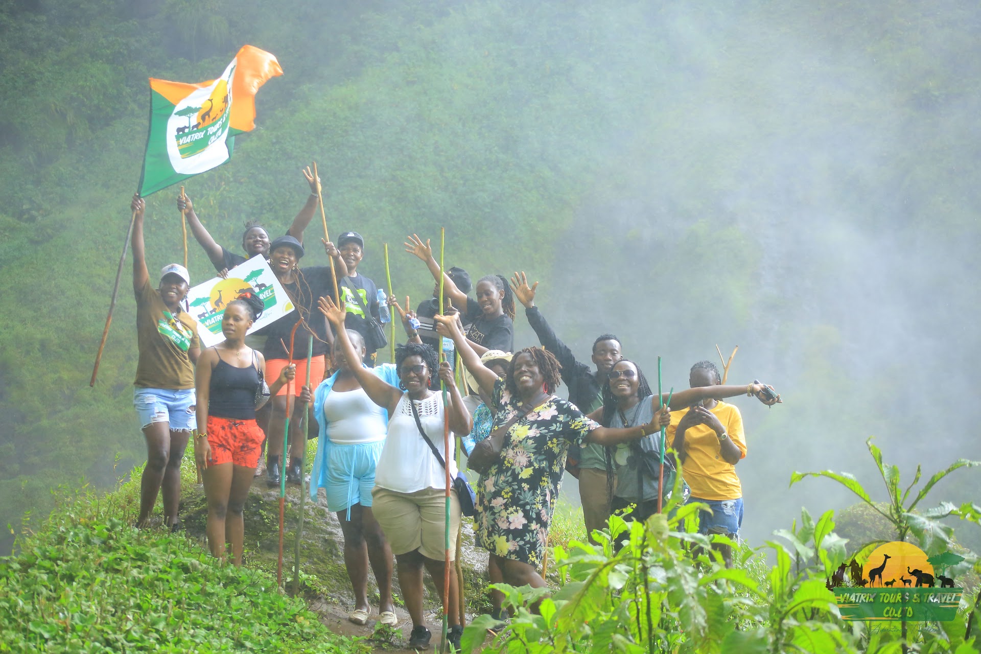 Viatrix travelers enjoying a waterfall adventure